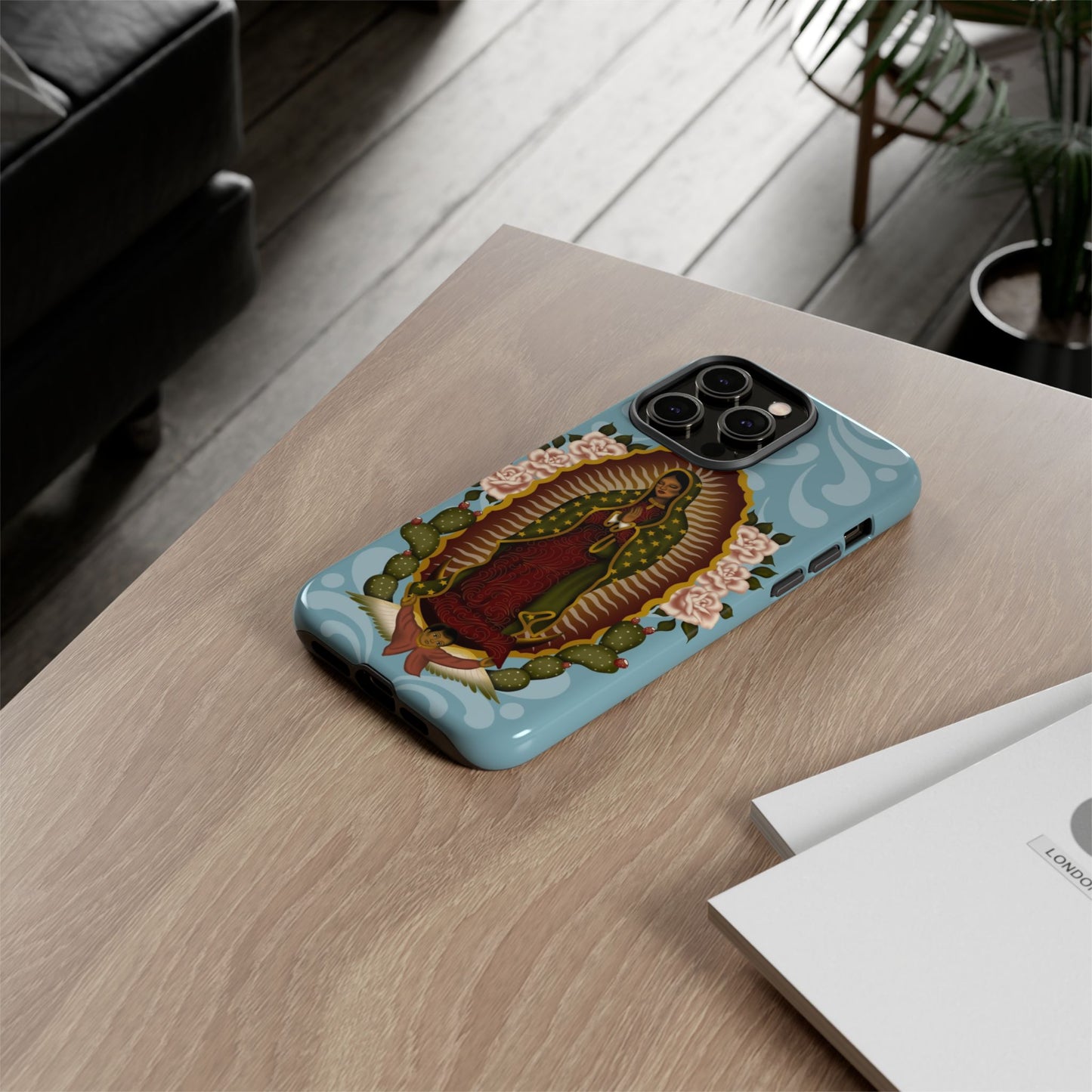 Virgen de Guadalupe iPhone case with light blue Talavera background