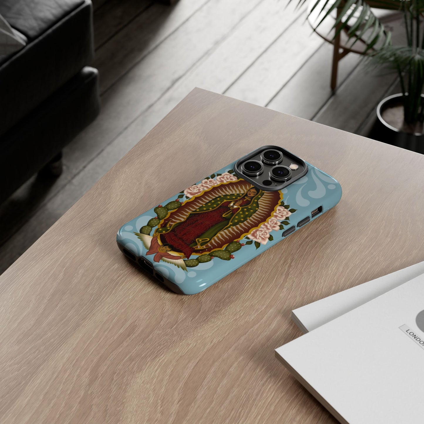 Virgen de Guadalupe iPhone case with light blue Talavera background