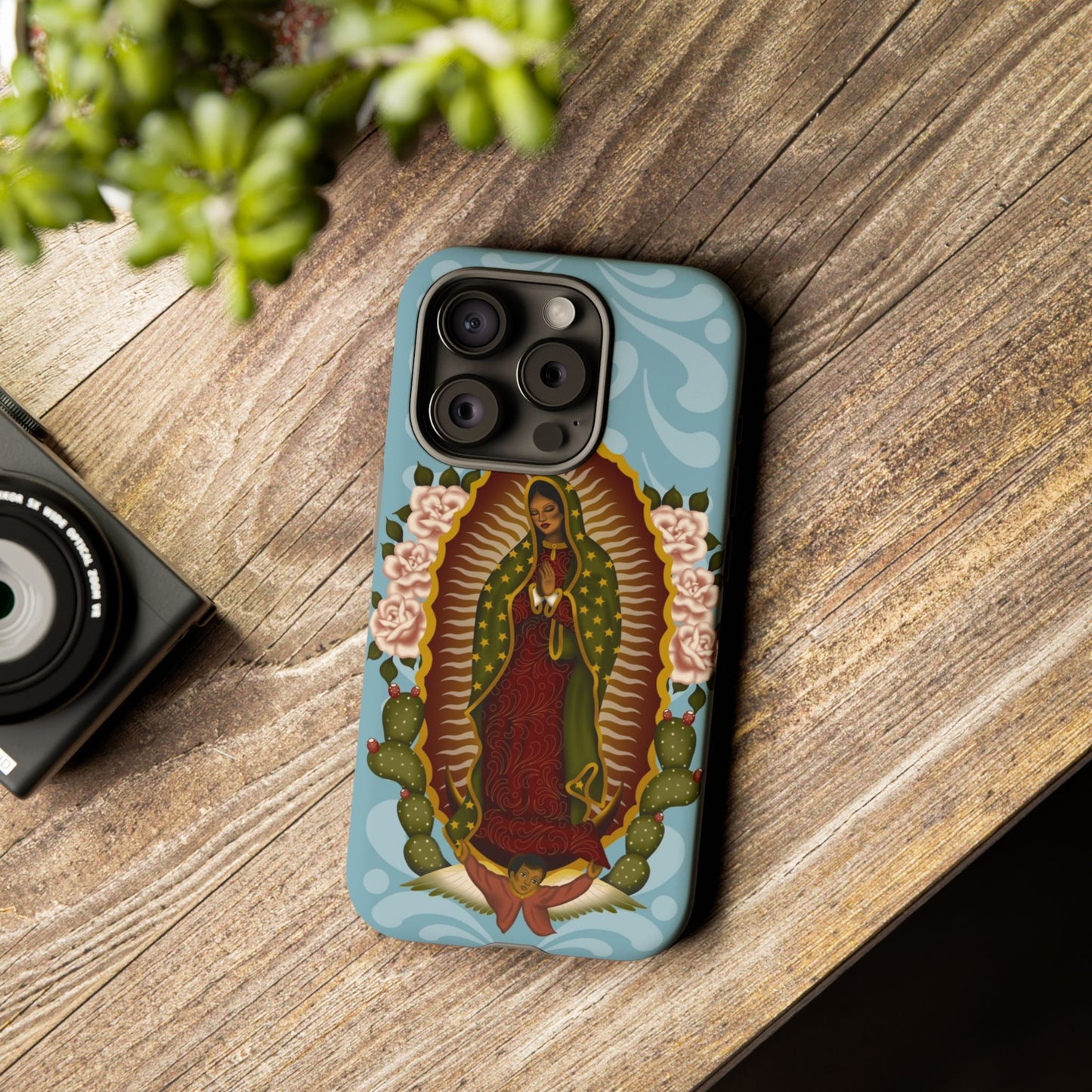Virgen de Guadalupe iPhone case with light blue Talavera background