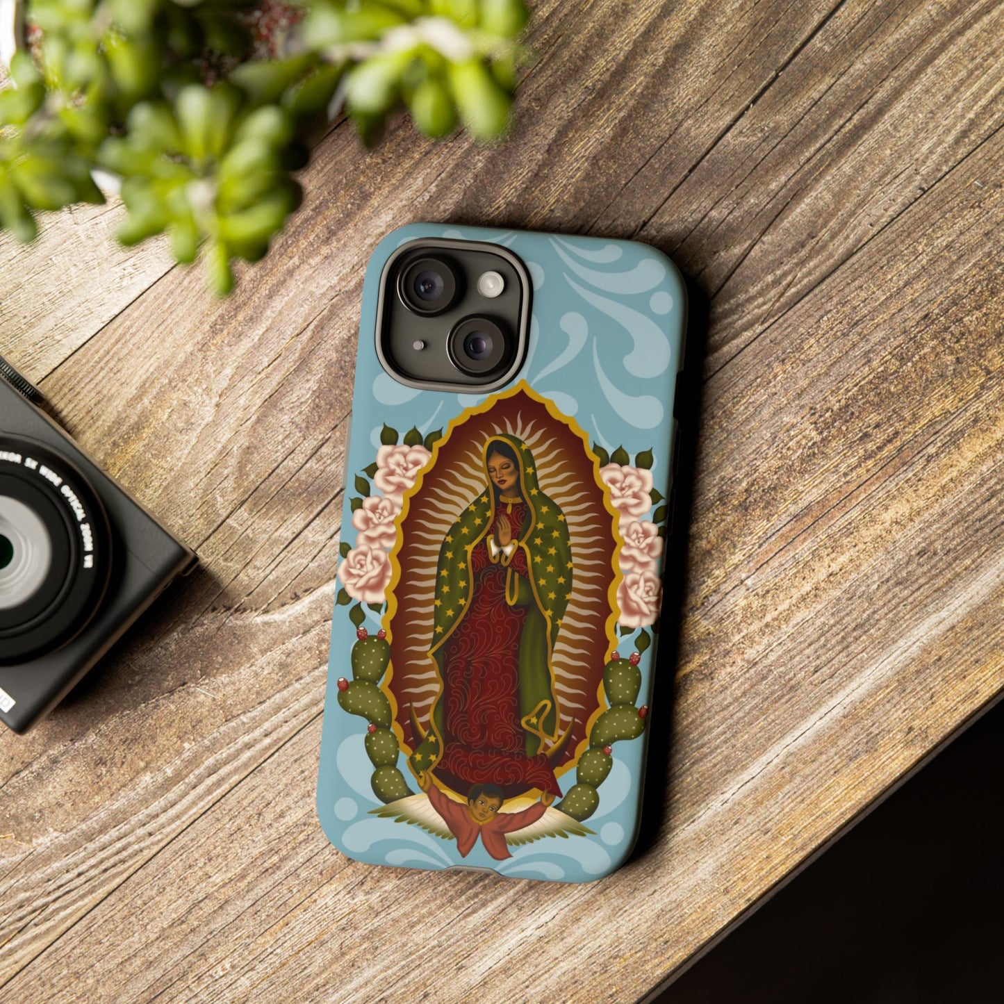 Virgen de Guadalupe iPhone case with light blue Talavera background
