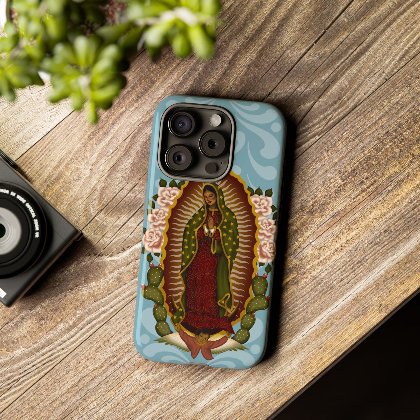 Virgen de Guadalupe iPhone case with light blue Talavera background