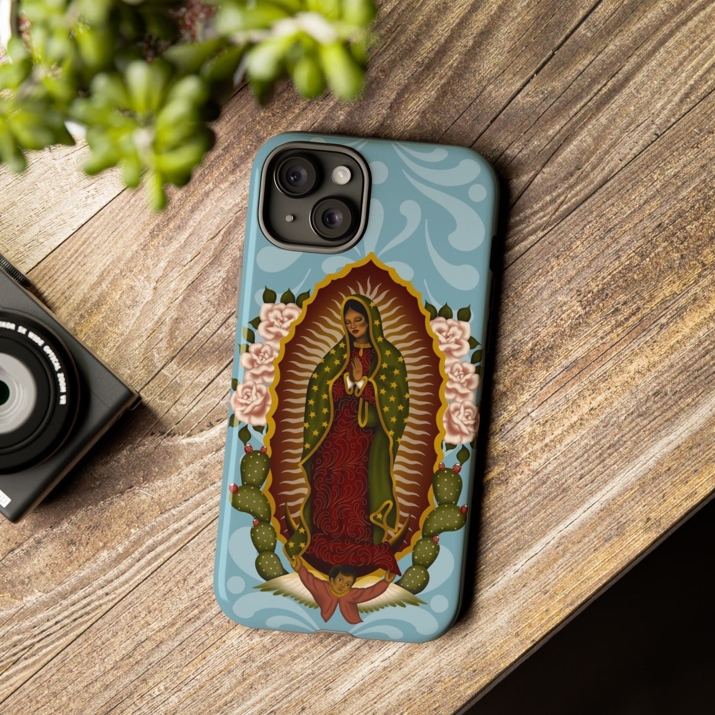 Virgen de Guadalupe iPhone case with light blue Talavera background