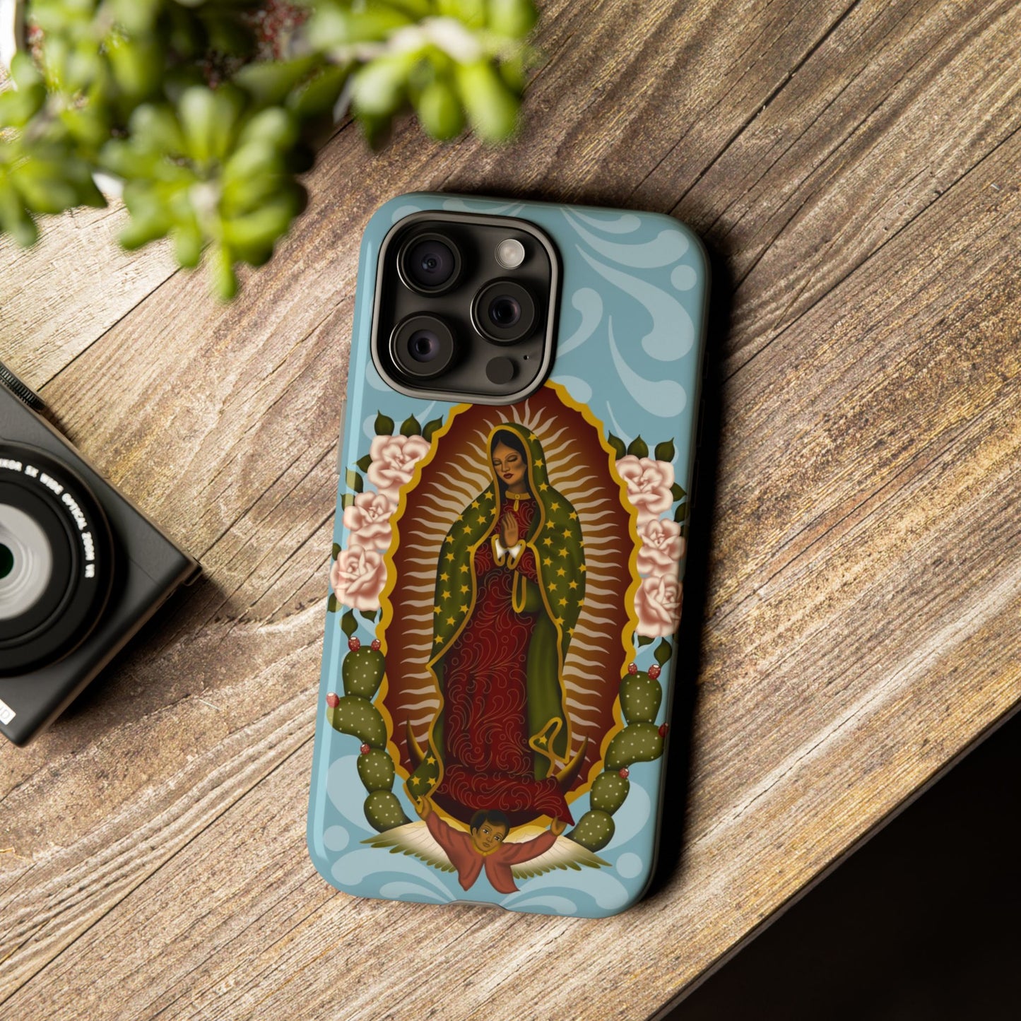 Virgen de Guadalupe iPhone case with light blue Talavera background